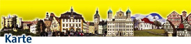 Says Karte at bottom and shows typical German Building under a yellow sky - Romantische Straße
